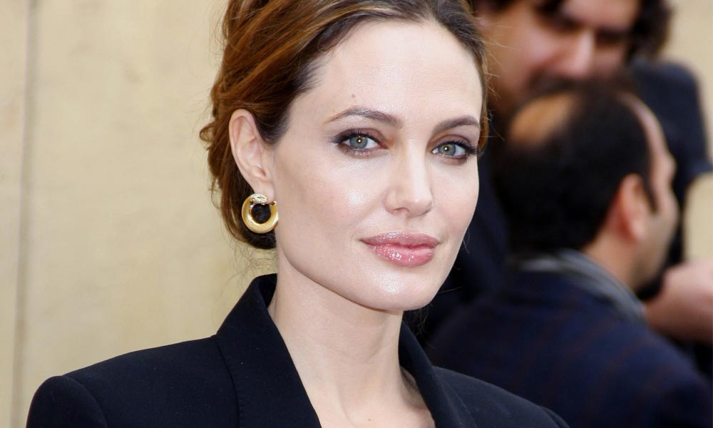 angelina jolie in a dark blazer with confident look after double mastectomy