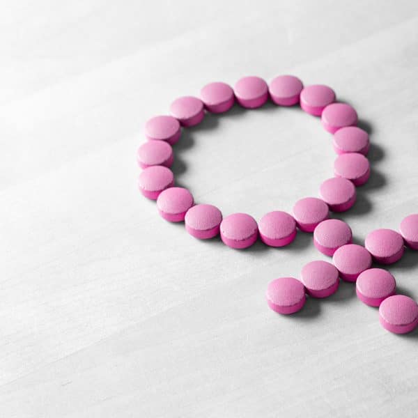 menopause symptoms showcasing pink tablets