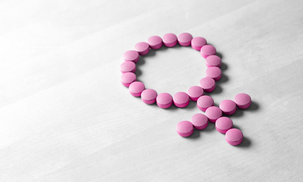 menopause symptoms showcasing pink tablets